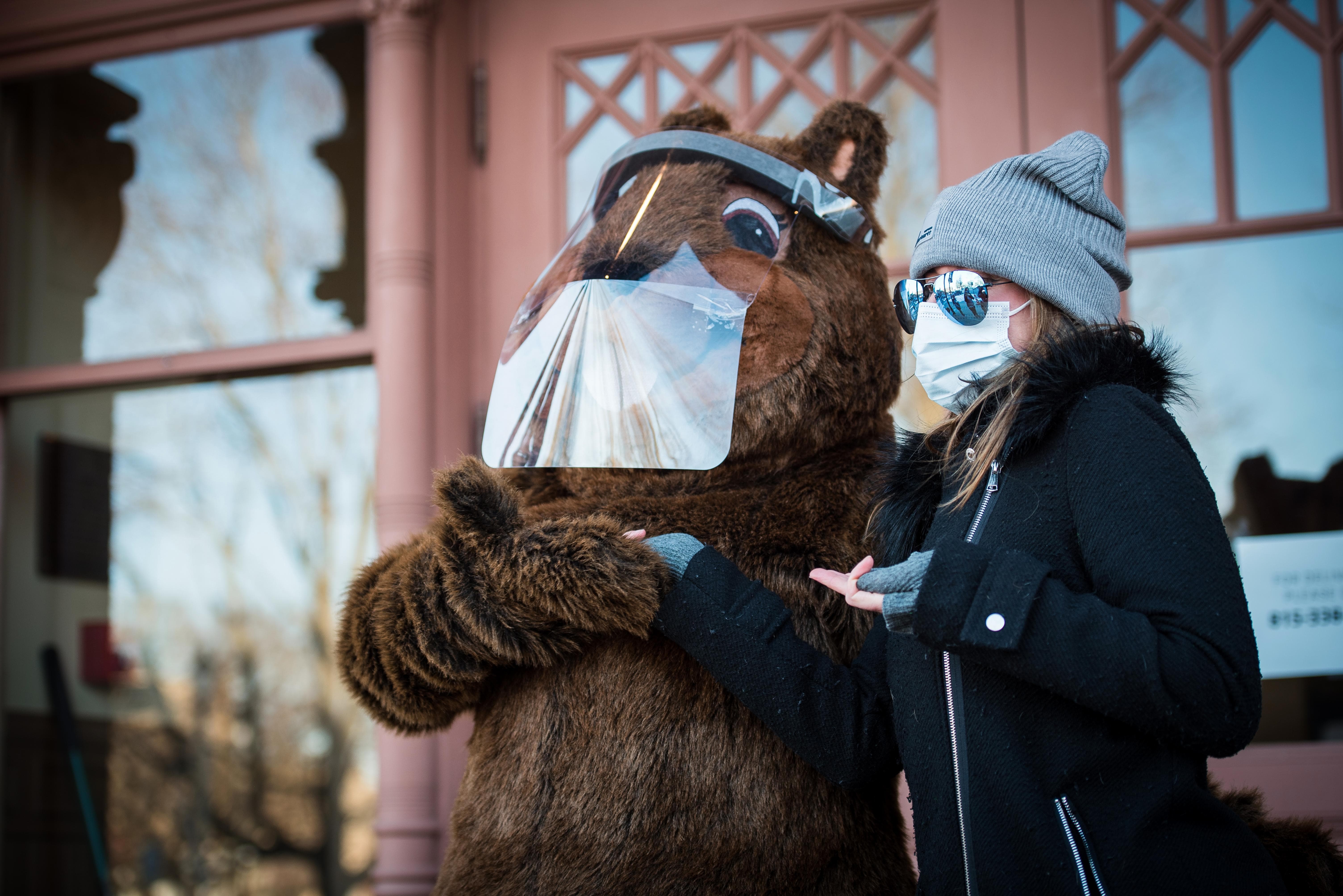 Slavin poses with Woodstock Willie in Dordan-provided face shield